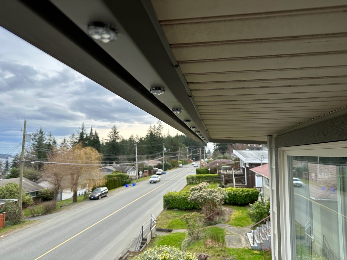 Gemstone Lights track along the soffit above a Comox Valley street.